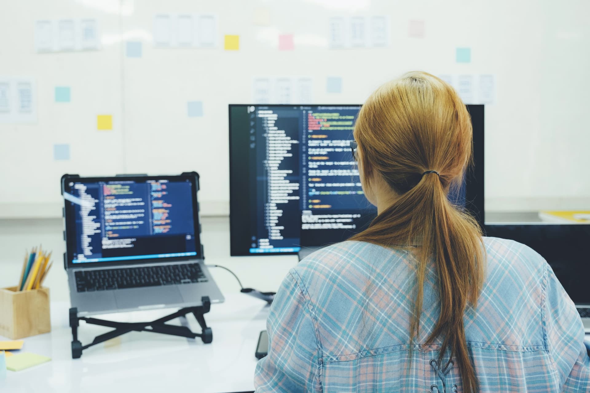 Programmer is coding and programming software.