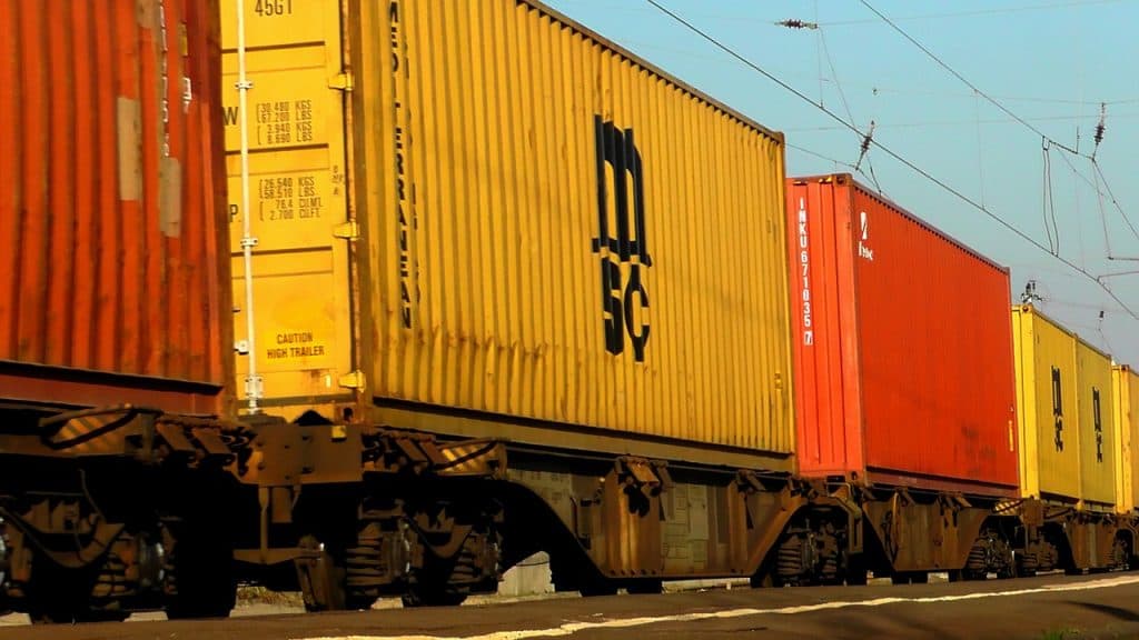 Freight train with cargo containers, illustrating how blockchain can be applied to logistics and transport operations.