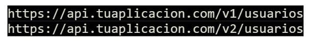 Example of versioned API endpoints: /v1/usuarios and /v2/usuarios, illustrating URL-based versioning.