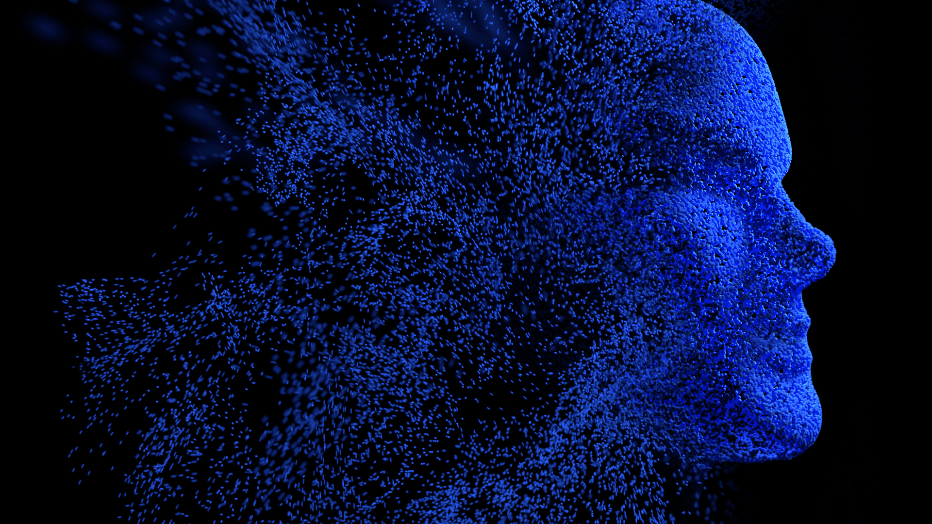 Digital illustration of a human head made of blue particles dispersing on a black background, symbolizing the evolution of artificial intelligence.