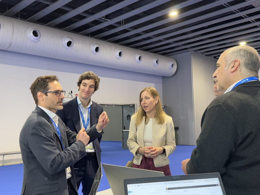 Group of attendees discussing automation and technology at Advanced Factories 2025.