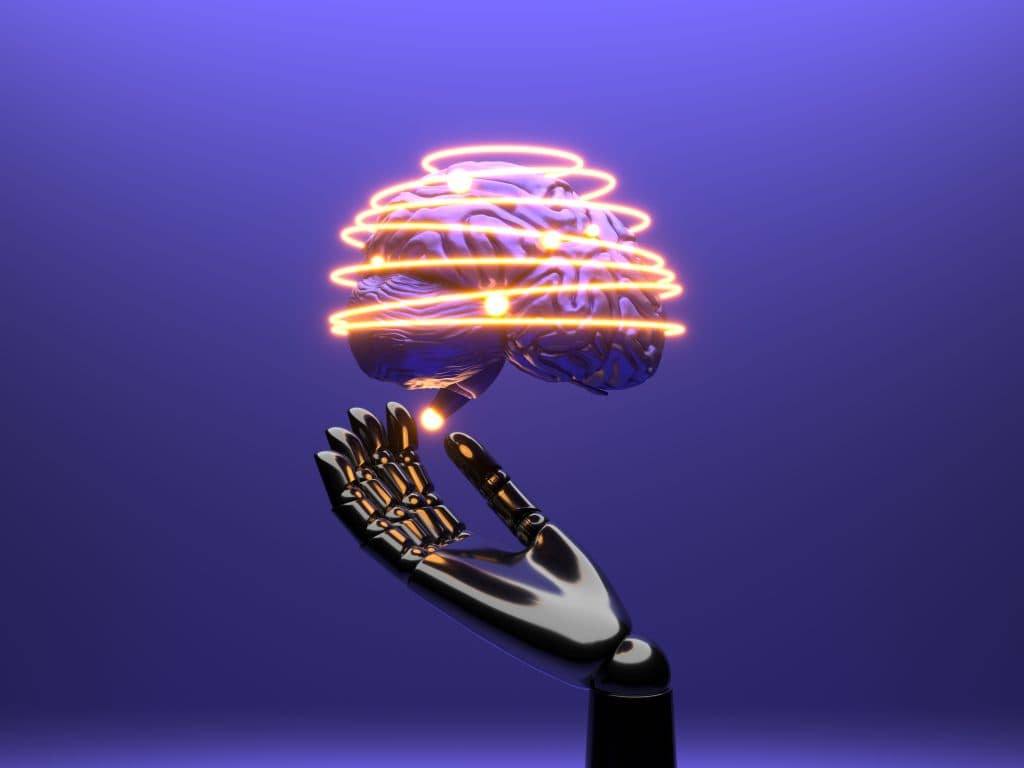 Robotic hand holding an illuminated brain surrounded by glowing lines, symbolizing artificial intelligence and technological innovation.